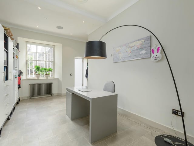 This is one of the seven bedrooms, but it has been converted into an office to allow for easy home working. You could use it as a bedroom, but a home office could be useful just now.