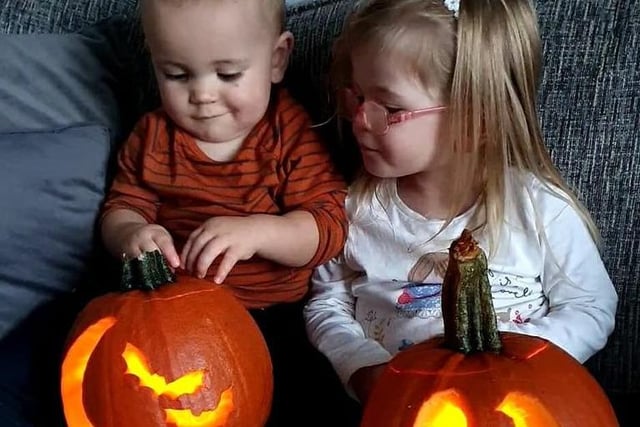 This pair admire their pumpkins while chilling on the sofa. Image: Kelly Harrison