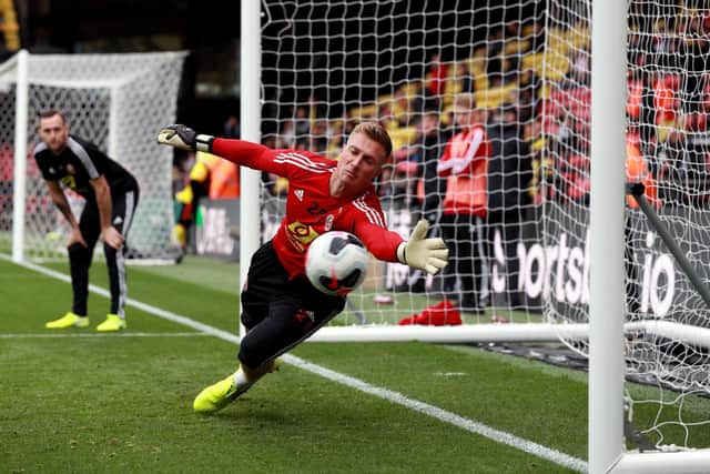 Sheffield United goalkeeper Simon Moore warms up before the Premier League match at Vicarage Road, Watford: Ian Walton/PA Wire.