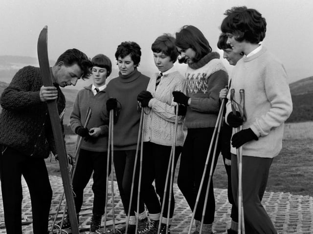 Edinburgh school children having skiing lessons on the new plastic slope provided by Edinburgh Corporation at Hillend in October 1965.