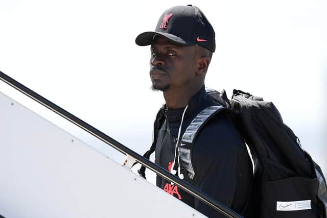 Liverpool's Senegalese striker Sadio Mane walks to the plane at Liverpool John Lennon Airport on May 27, 2022, before leaving for Paris to compete in the UEFA Champions League final against Real Madrid. (Photo by Oli SCARFF / AFP) (Photo by OLI SCARFF/AFP via Getty Images)
