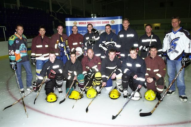 Ron Shudra, left, and Neil Able, right, with the GB Firefighters team to  promote the World Firefighter Games 2004 at iceSheffield, April 23, 2004
