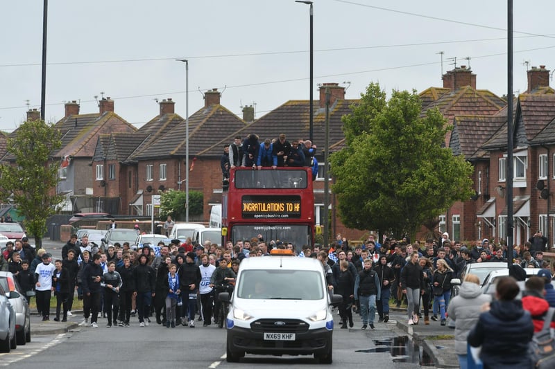 The Hartlepool United open topped bus parade arrives at The Brus roundabout.