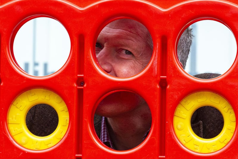 Willie Rennie playing giant Connect 4.