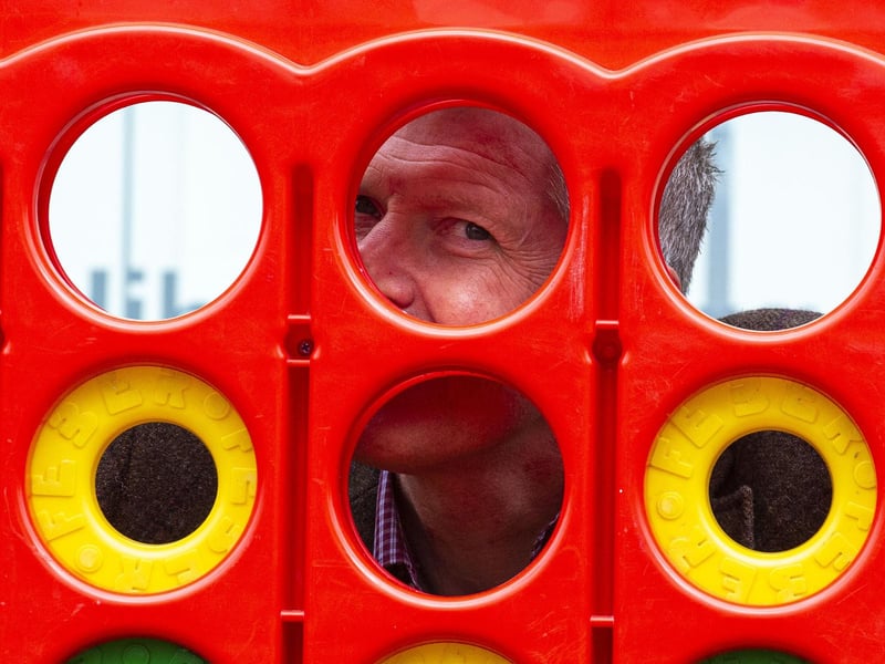 Willie Rennie playing giant Connect 4.
