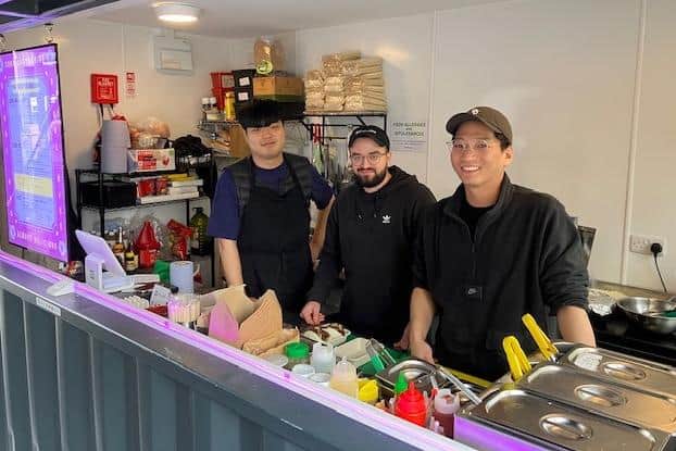 Pictured is Ervin Soula, centre, with colleagues at the Clapping Seoul eatery, at Sheffield's new Fargate Container Park.
