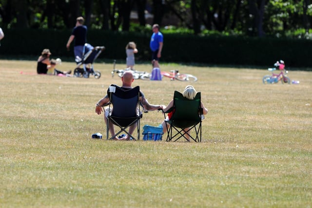 Families could be seen making the most of the warm weather by sunbathing in Bents Park.