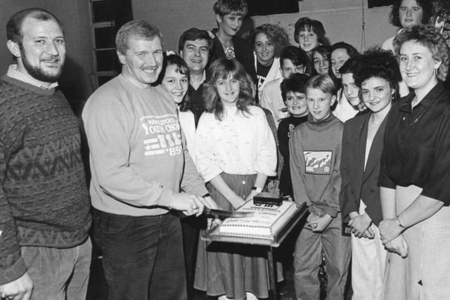 Hartlepool Youth Choir Leader Chris Simmonds, cuts the cake at a reunion party held to celebrate the choir's 20th birthday.  But in which year?