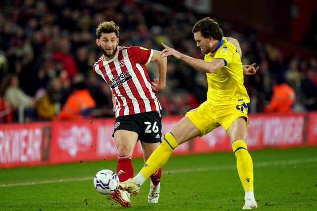Sheffield United's Charlie Goode and Blackburn Rovers' Sam Gallagher (right) battle for the ball during the Sky Bet Championship match at Bramall Lane, Sheffield: Mike Egerton/PA Wire.