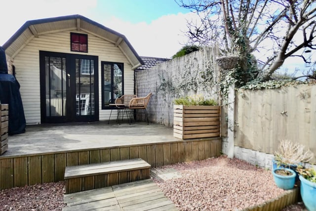 The enclosed garden is said to be low maintenance with a raised decking area, leading to the summer house with power and lighting - which makes it ideal for entertaining.