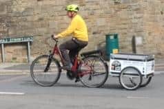Richard King of Dronfield Wine World making deliveries on his e-bike