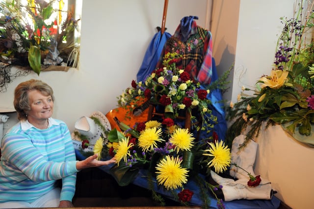 Holy Trinty Church, Ashford-in-the Water, Flower Festival in 2008 Visitor Margaret Tustin admires the Country & Western theme display