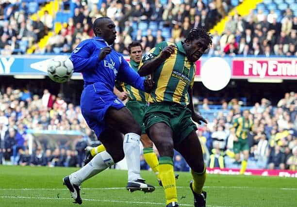 Jimmy-Floyd Hasselbaink and Darren Moore doing battle in their playing days.