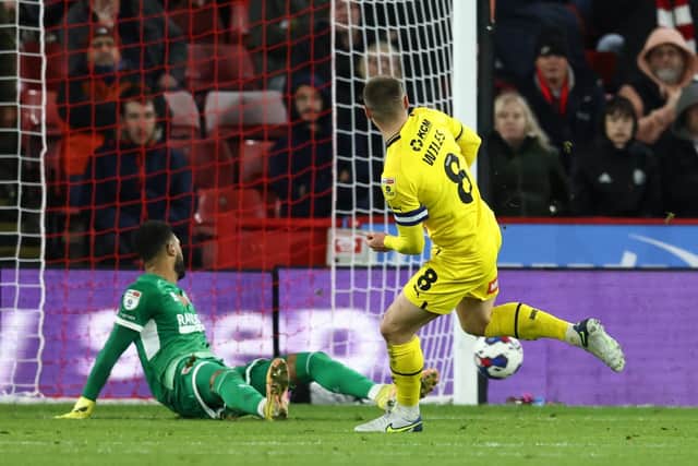 Ben Wiles of Rotherham United scores the game's only goal past Sheffield United's Wes Foderingham