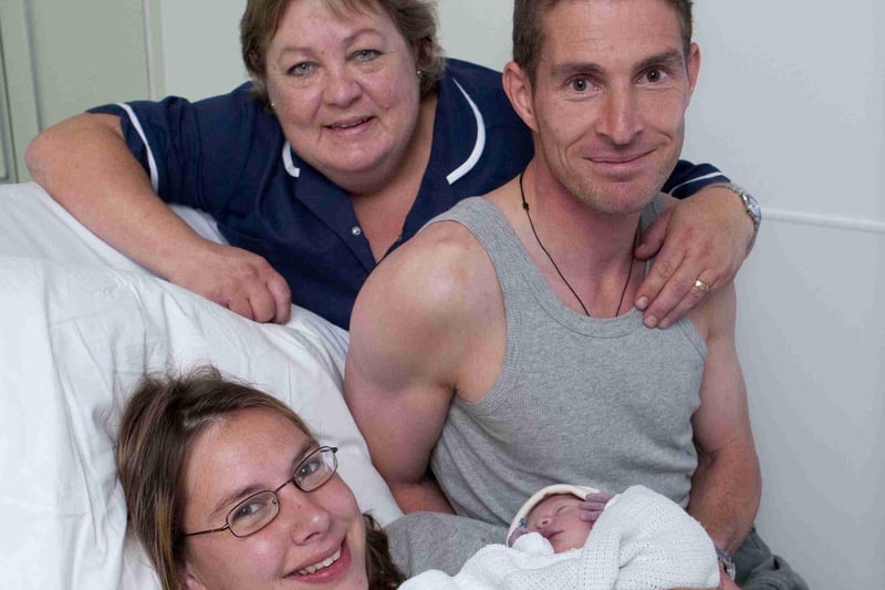 Midwife Caroline Wilton with Hollie Philip-Smith and Matthew Bullen and new arrival Lilly , the first baby born at the new birth centre at Chesterfield Royal Hospital in 2009.
