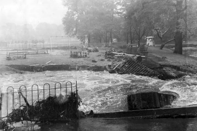 Severe flooding struck Sheffield in July 1958 - the Sheaf Valley was badly hit and Broadfield Road was deluged to a depth of two feet. This picture shows Millhouses Park, and the remains of a bridge which spanned the river.