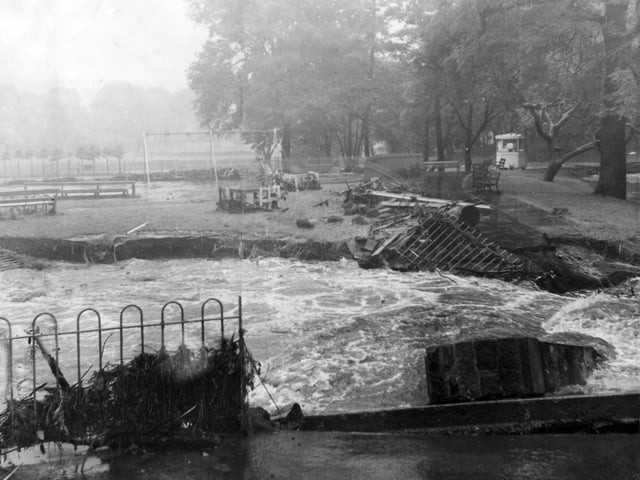 Severe flooding struck Sheffield in July 1958 - the Sheaf Valley was badly hit and Broadfield Road was deluged to a depth of two feet. This picture shows Millhouses Park, and the remains of a bridge which spanned the river.