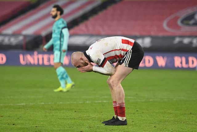 Striker Oli McBurnie, of Sheffield United, reacts after missing a chance during Blades' 2-0 defeat to Liverpool at Bramall Lane last night. (Photo by Oli Scarff - Pool/Getty Images)