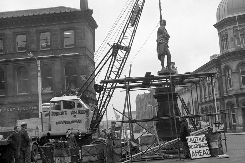 The Robert Burns statue in Constitution Street being removed for cleaning in August 1961.