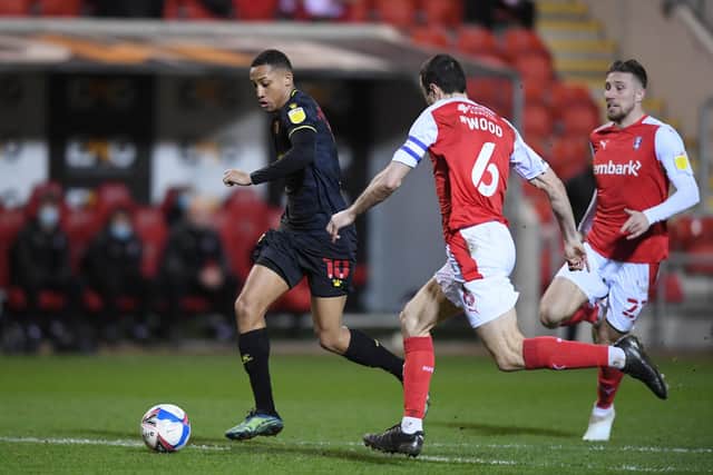 Joao Pedro of Watford runs with the ball whilst under pressure from Richard Wood.
