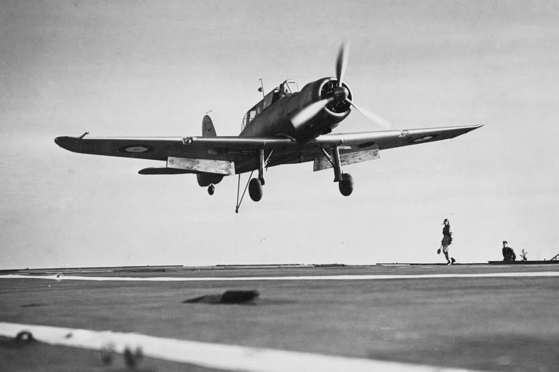 A Royal Navy Fleet Air Arm Blackburn B24 Skua MkII carrier-based low-wing, two-seater, single-radial engine dive bomber/fighter aircraft of No.803 Naval Air Squadron comes into land on the flight deck of the aircraft carrier HMS Ark Royal on 16th November 1939.  (Photo by Fox Photos/Hulton Archive/Getty Images).