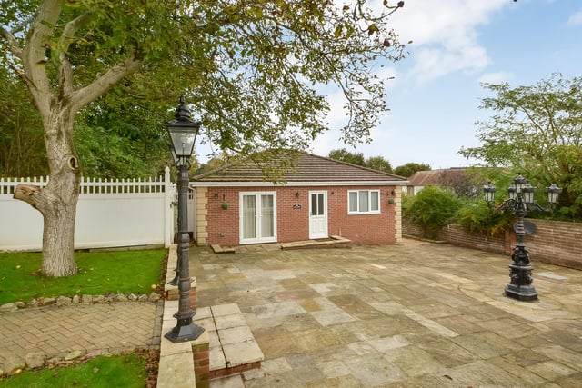 This huge five-bedroom Portsdown Hill home in Portsmouth is up for raffle. Pictured is the property's garden annex, which has two bedrooms, a living room and a kitchenette.