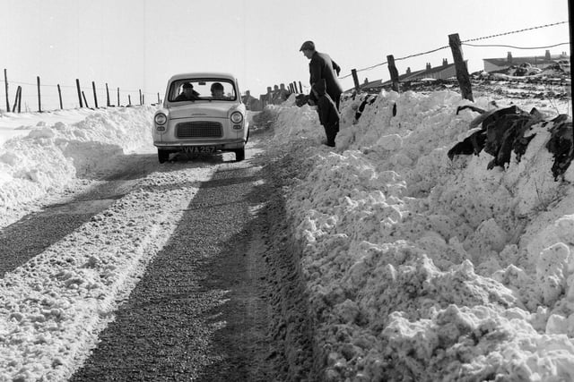 A vehicle drives through snow on the B715 near Forth in Lanarkshire. 18 February, 1964