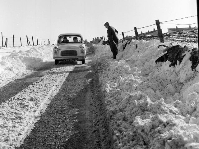 A vehicle drives through snow on the B715 near Forth in Lanarkshire. 18 February, 1964