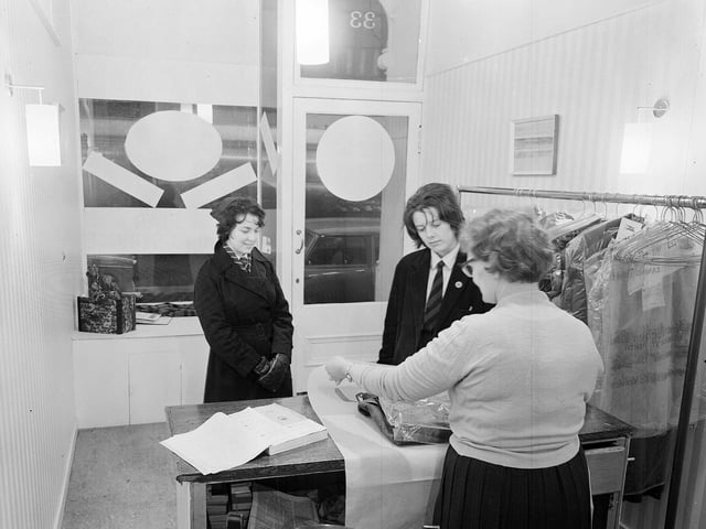 A customer at the Elliot Forbes Ltd Dry Cleaning shop on Dalry Road in January 1963.