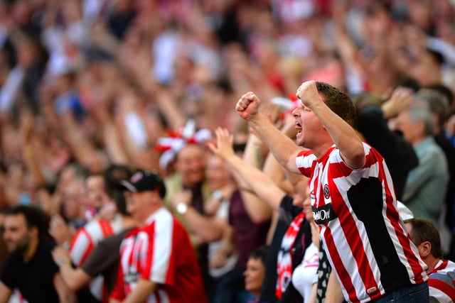 Sheffield United fans celebrate as Stefan Scougall scores their second goal during the FA Cup semi-final match between Hull City and Sheffield United at Wembley Stadium on April 13, 2014.  (Photo by Laurence Griffiths/Getty Images)