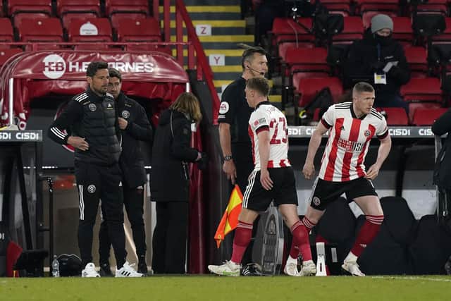 John Lundstram (right) is set to leave Sheffield United this summer: Andrew Yates / Sportimage