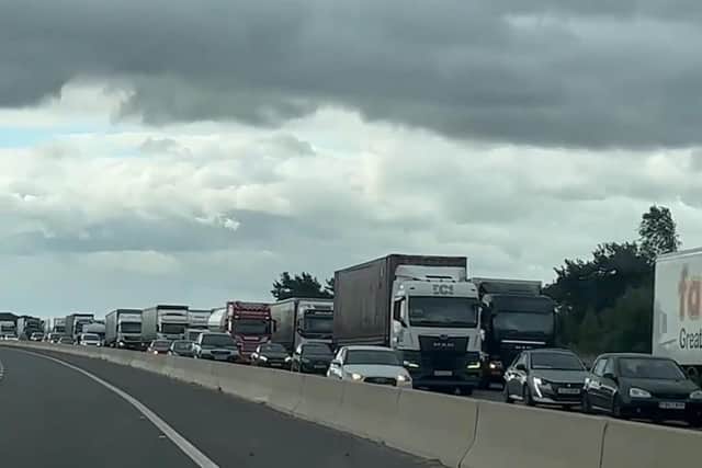 A still image from a video showing the 'go slow' fuel protest by lorries on the M180 near Doncaster. Credit BBC Radio Humberside.