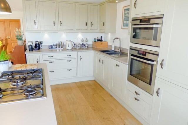 A kitchen of the highest quality and design exhibiting a range of heritage grey shaker style units with Rennie Mackintosh handles and Silestone work surfaces.

Picture: Right Move