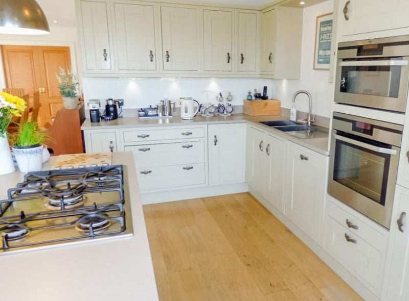 A kitchen of the highest quality and design exhibiting a range of heritage grey shaker style units with Rennie Mackintosh handles and Silestone work surfaces.

Picture: Right Move
