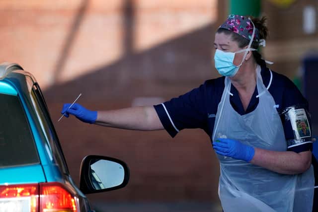 Nurses instruct and help NHS workers as they self swab for coronavirus at a drive through testing site in Sheffield (Photo by Christopher Furlong/Getty Images)
