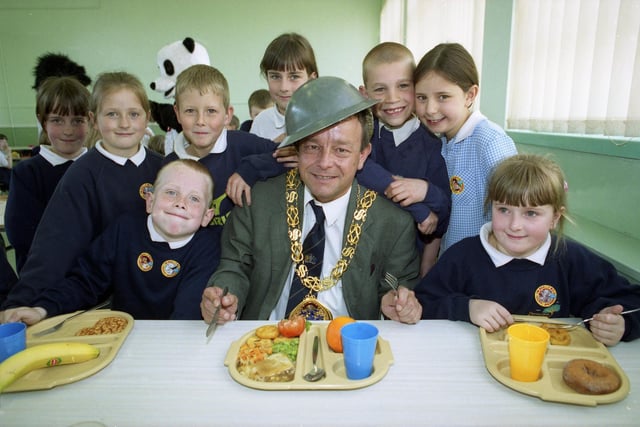 The Mayor of Sunderland, Coun Wally Scott, donned a Second World War steel helmet as part of lunchtime learning activities at Thorney Close Primary School in 1999.