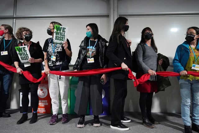 People stage a climate justice protest ahead of the stock take briefing (Getty Images)
