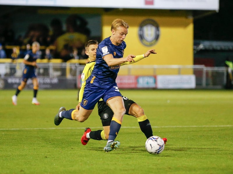 Mansfield Town midfielder George Lapslie drives forward.