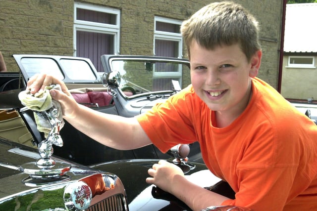 Pictured at the Rotary Club of Hope Valley Annual Vintage and  Classic Car Show in 2001 was 12-year-old- Robert Handley putting the finishing shine on Grandad Henry Gillott's 1946 Triumph Roadster