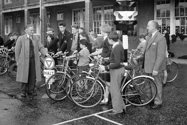 Children are pictured listening to police instructors during their cycling proficiency test at Balgreen School in 1962.