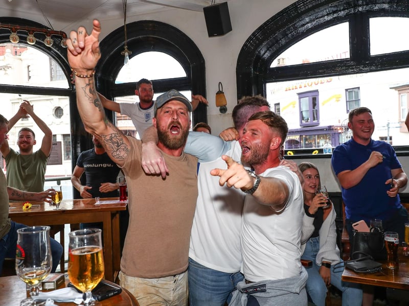 Fans pictured in The Kings pub celebrating on the final whistle. Picture: Stuart Martin (220421-7042)