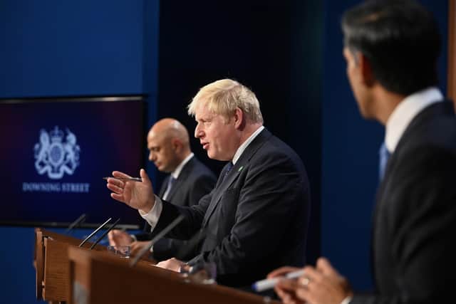 LONDON, UNITED KINGDOM - SEPTEMBER 7:  Britain's Prime Minister Boris Johnson, Britain's Chancellor of the Exchequer Rishi Sunak, and Britain's Health Secretary Sajid Javid attend a news conference in Downing Street on September 7, 2021 in London, England. British Prime Minister Boris Johnson has outlined plans to raise taxes to pay for reforms to the social care system and the recovery of the NHS after the pandemic.  (Photo by Toby Melville-WPA Pool/Getty Images)