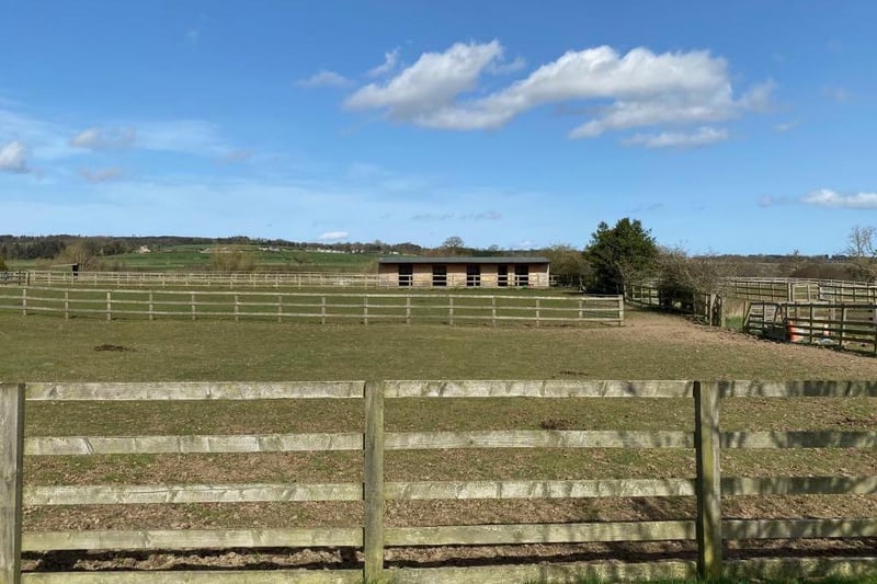 The property includes three acres of post and rail fenced paddocks.