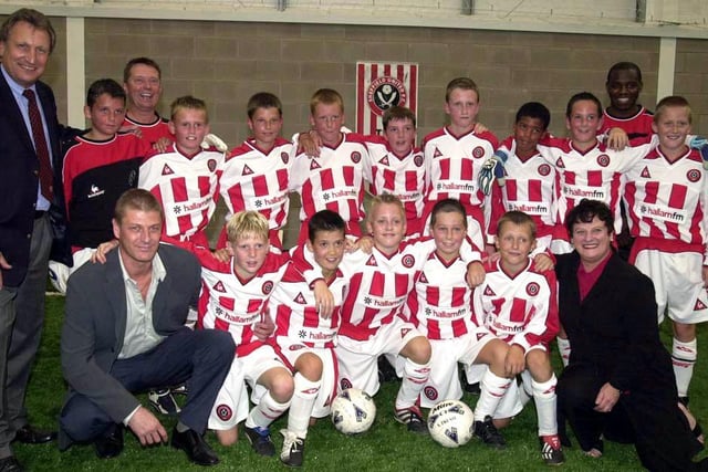 Sean Bean pictured  at the opening of the new Sheffield FM Academy at Sheffield United on Shirecliffe Road with Linda Larder of Hallam FM, Sheffield United manager Neil Warnock and some of the academy youngsters,  August 30, 2002.