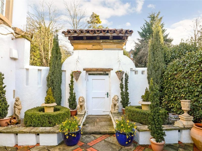 There is an immaculate courtyard garden leading from the conservatory and winding down to the lower ground floor.