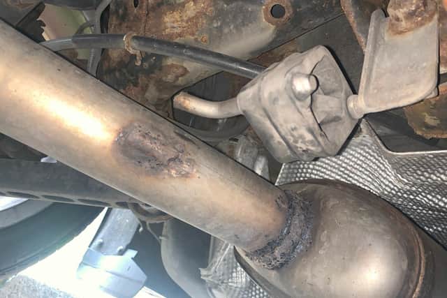 The owner of this car says the exhaust was sheared from its mounting when crossing the new speed bumps at Asda in Handsworth, Sheffield