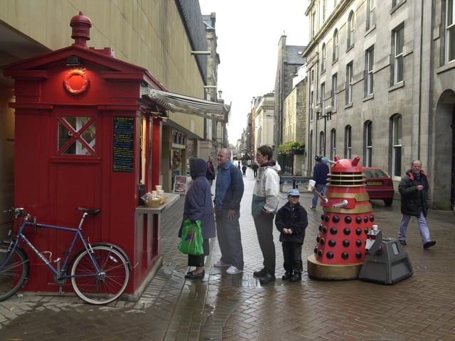 Gordon Thompson Director of The Californian Coffee Co. welcomes his first customer, Alec the Dalek , at the latest opening of his Police Box coffee stops in Rose Street.