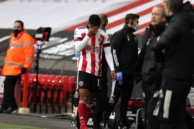 Max Lowe of Sheffield United leaves the pitch injured during the Premier League match with Fulham at Bramall Lane: Andrew Yates/Sportimage