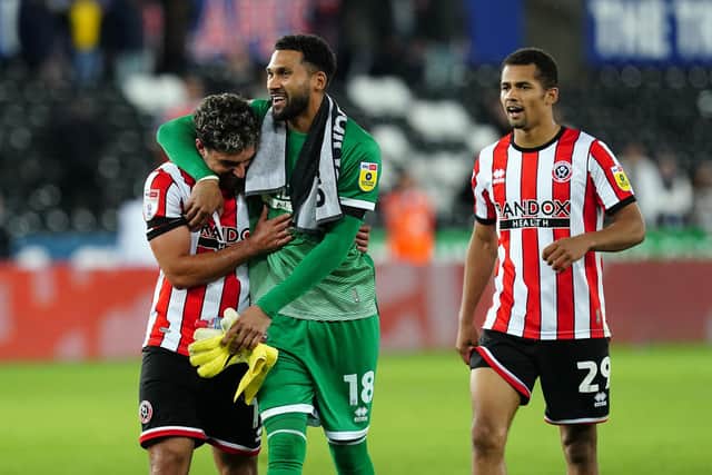 Sheffield United's Reda Khadra and goalkeeper Wes Foderingham celebrate after the Sky Bet Championship match at the Swansea.com Stadium, Swansea: David Davies/PA Wire.