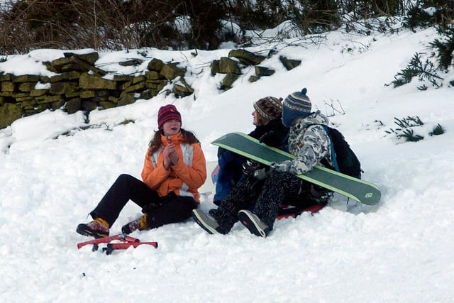 Snowboarders having fun in snow-covered Ringinglow, Sheffield in December 2010